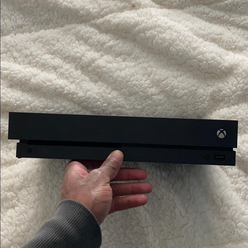 Xbox one X. (Cords will be included)